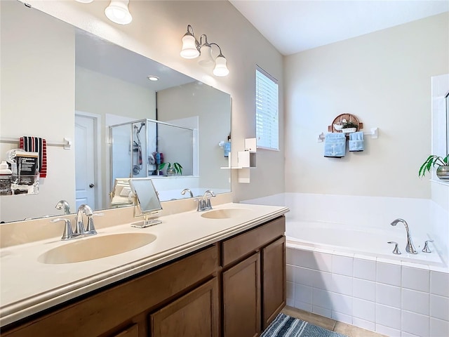 bathroom with tile patterned floors, independent shower and bath, and vanity