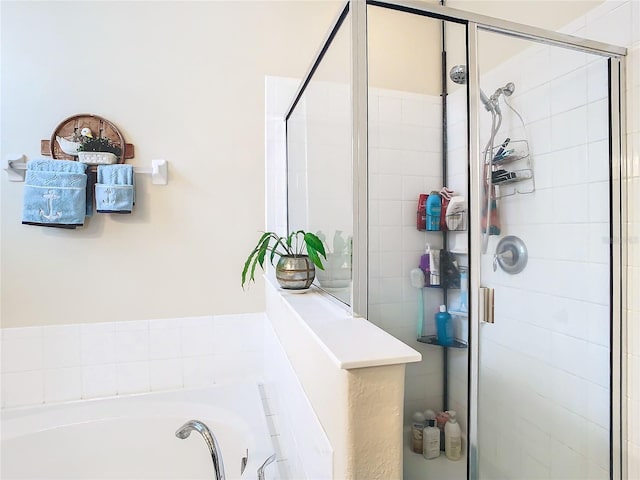 bathroom with shower with separate bathtub