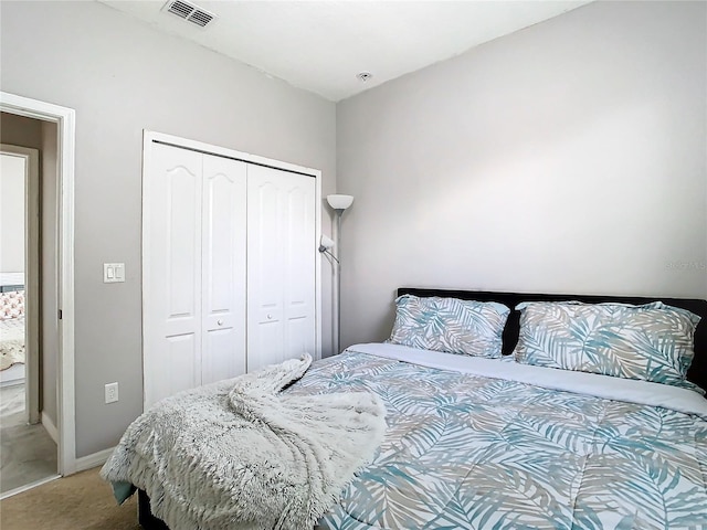 bedroom featuring a closet and carpet