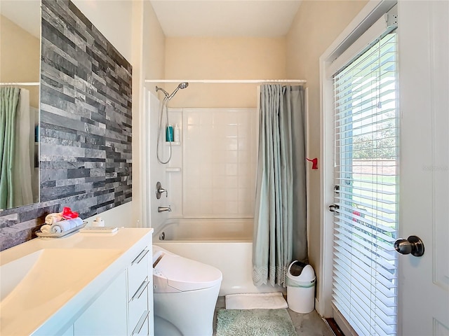 full bathroom featuring vanity, toilet, and shower / bath combo with shower curtain