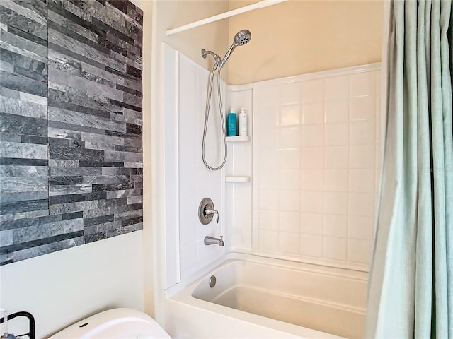 bathroom featuring shower / bath combo with shower curtain