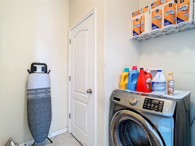 clothes washing area featuring washer / dryer