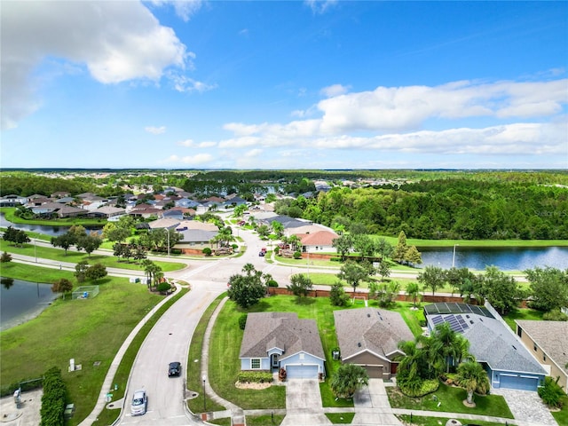 bird's eye view with a water view