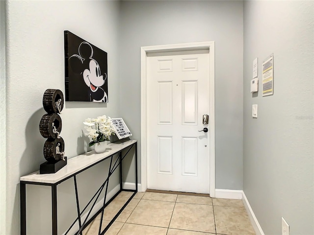 foyer featuring light tile patterned floors