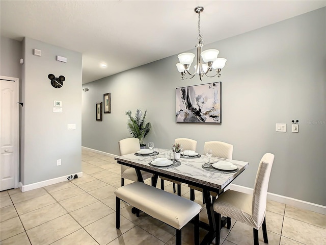 dining area featuring an inviting chandelier and light tile patterned floors