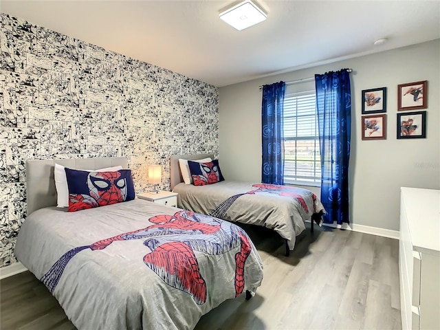 bedroom with hardwood / wood-style floors