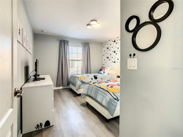 bedroom with wood-type flooring