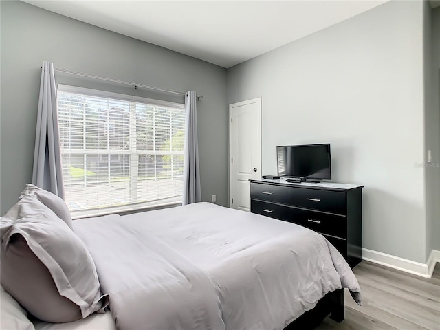 bedroom featuring hardwood / wood-style flooring