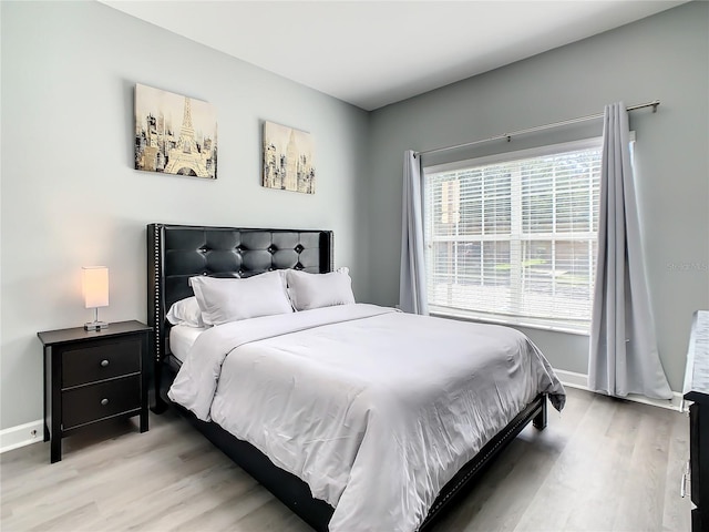 bedroom with light wood-type flooring