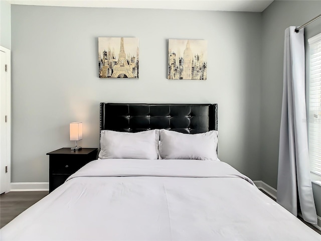 bedroom featuring dark hardwood / wood-style floors