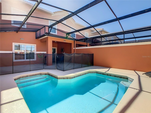 view of pool featuring a patio area and a lanai