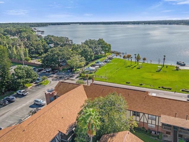 birds eye view of property with a water view