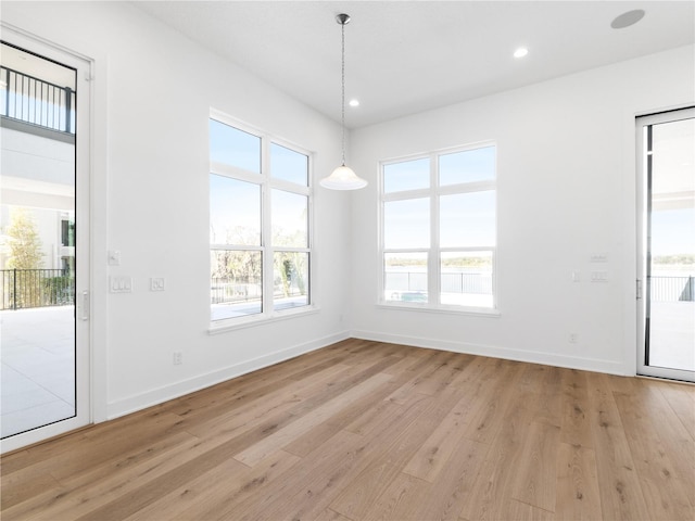 unfurnished dining area with light hardwood / wood-style flooring