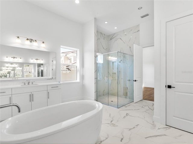 bathroom featuring separate shower and tub and vanity