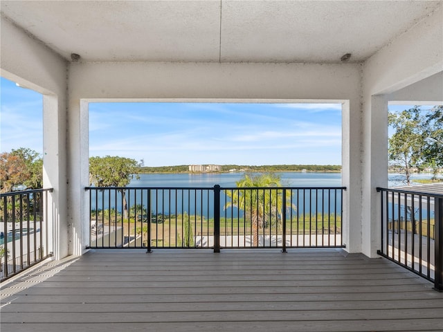 deck featuring a water view