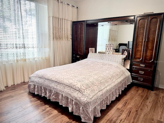 bedroom featuring wood finished floors