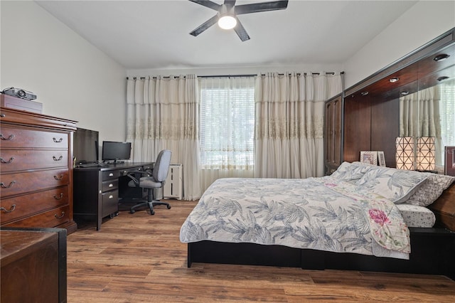 bedroom with a ceiling fan and wood finished floors