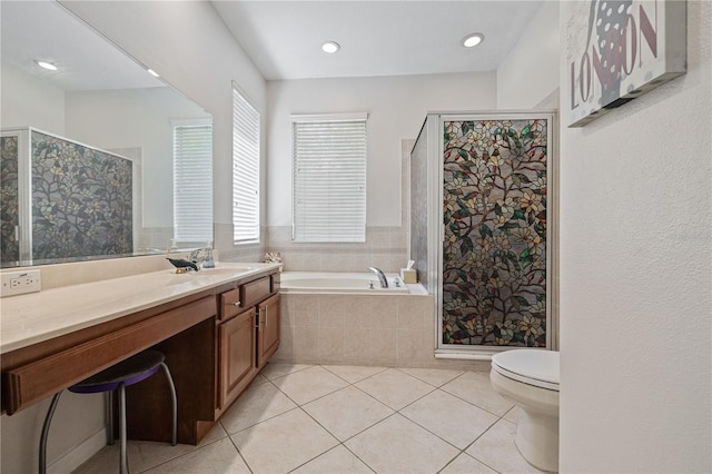 full bath with a bath, a shower stall, tile patterned flooring, and vanity