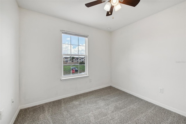 carpeted empty room with ceiling fan