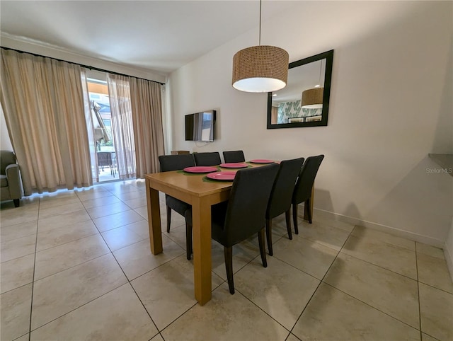 dining area with light tile patterned flooring