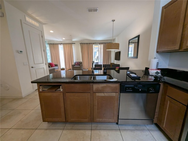 kitchen featuring hanging light fixtures, dark stone countertops, kitchen peninsula, light tile patterned flooring, and stainless steel dishwasher