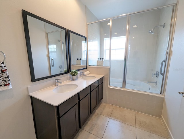 bathroom featuring tile patterned floors, enclosed tub / shower combo, and vanity