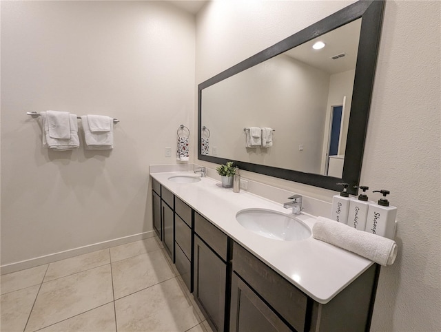 bathroom with vanity and tile patterned floors