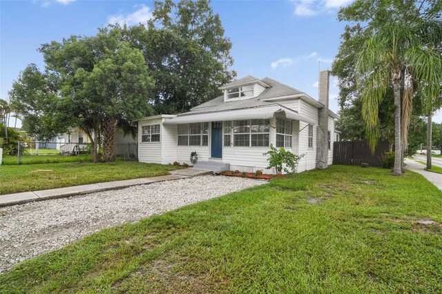 1700 Minnesota Ave, Saint Cloud, FL 34769 - bungalow-style home with a chimney