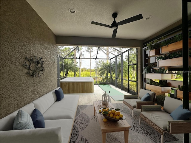 sunroom / solarium with a healthy amount of sunlight and ceiling fan