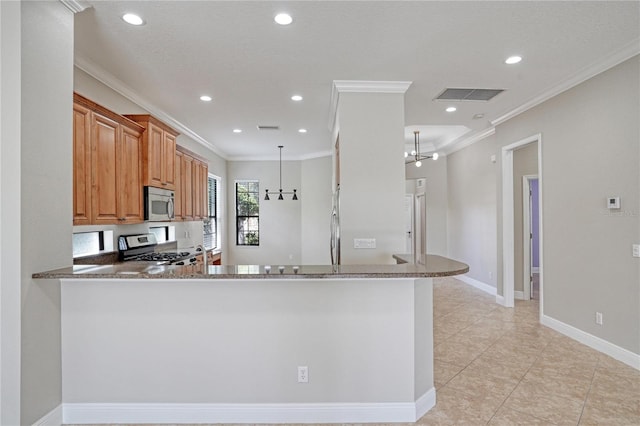 kitchen with ornamental molding, kitchen peninsula, decorative light fixtures, appliances with stainless steel finishes, and light stone countertops