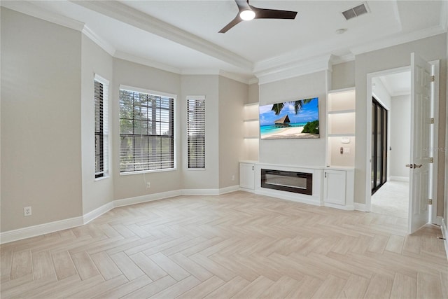 unfurnished living room featuring ceiling fan, light parquet floors, and crown molding