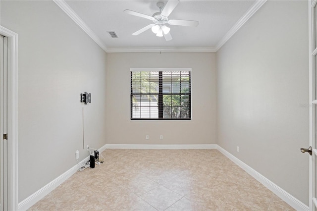 spare room with ceiling fan and crown molding