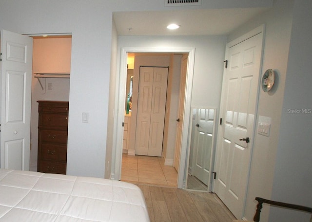 bedroom featuring visible vents, wood finished floors, and recessed lighting