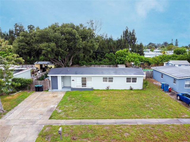 ranch-style home with a front yard