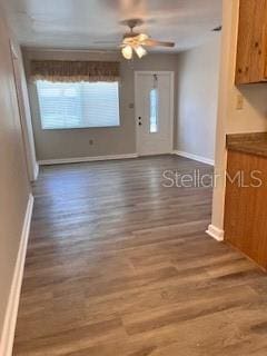 interior space featuring ceiling fan and hardwood / wood-style flooring