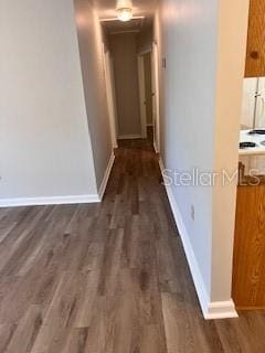 hall with dark hardwood / wood-style flooring