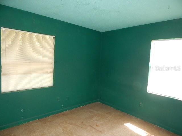 empty room with carpet flooring