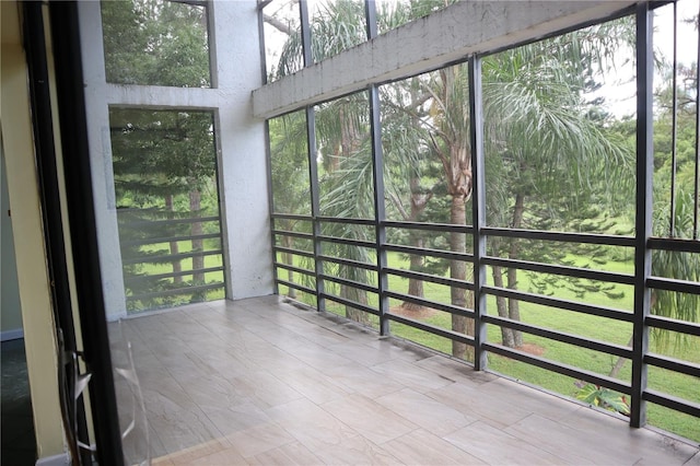 unfurnished sunroom featuring plenty of natural light