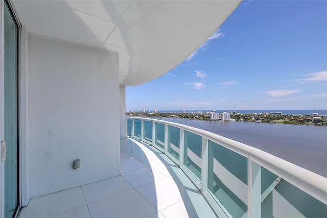 balcony featuring a water view