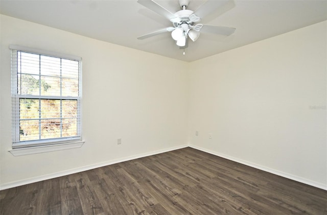 empty room featuring ceiling fan and dark wood-type flooring