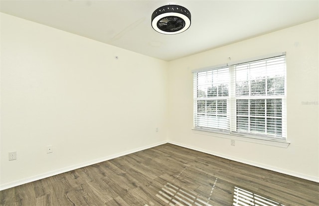 spare room featuring dark hardwood / wood-style flooring