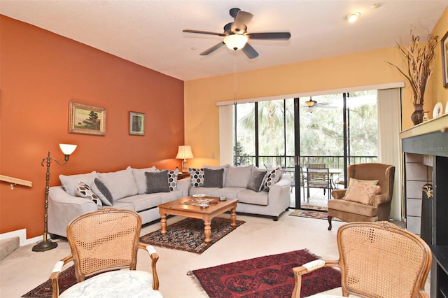 living room featuring carpet flooring and ceiling fan