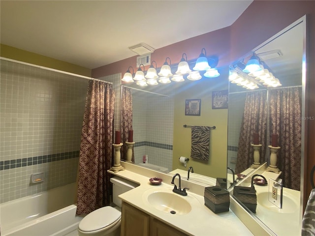 full bathroom featuring shower / bath combo, toilet, and vanity