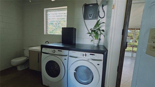 laundry room with washer and clothes dryer