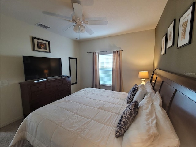 bedroom with carpet flooring, a ceiling fan, visible vents, and baseboards