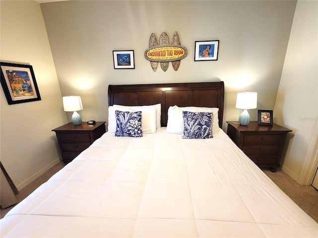 carpeted bedroom featuring baseboards