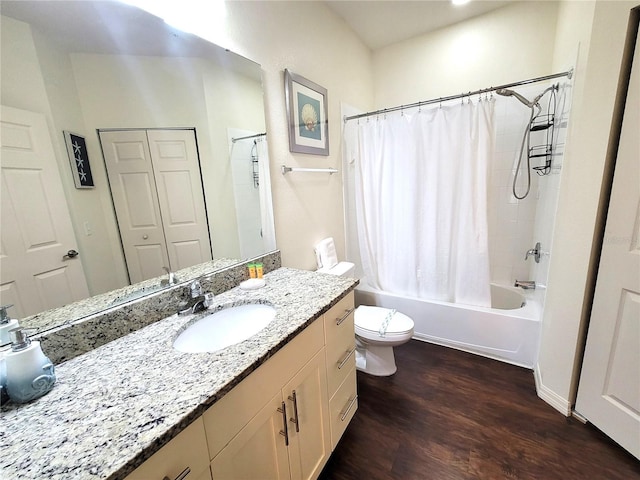 bathroom with toilet, wood finished floors, vanity, and shower / bath combination with curtain