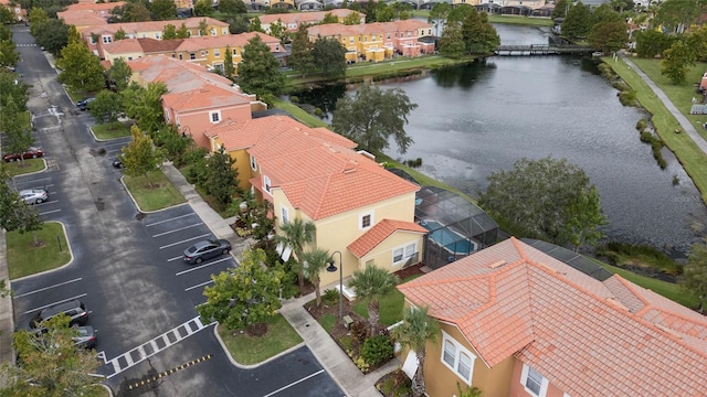 birds eye view of property with a water view