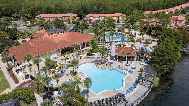 birds eye view of property with a water view