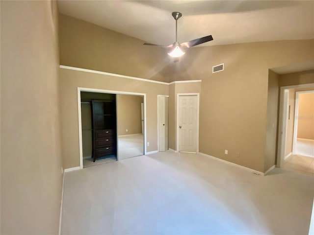 unfurnished bedroom featuring lofted ceiling and ceiling fan